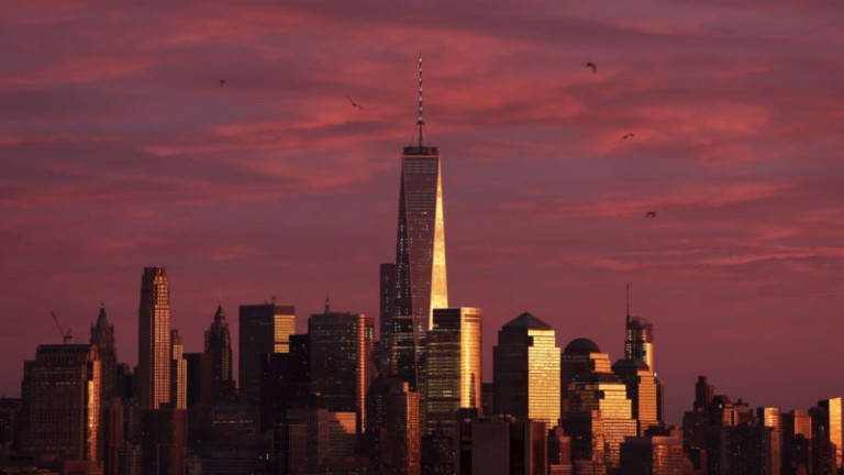 One World Trade Center and surrounding buildings at sunset 