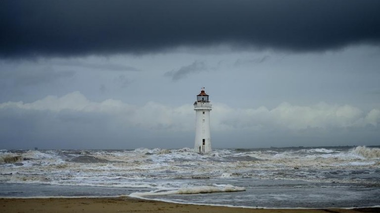 Storm clouds gather above Perch Rock lighthouse