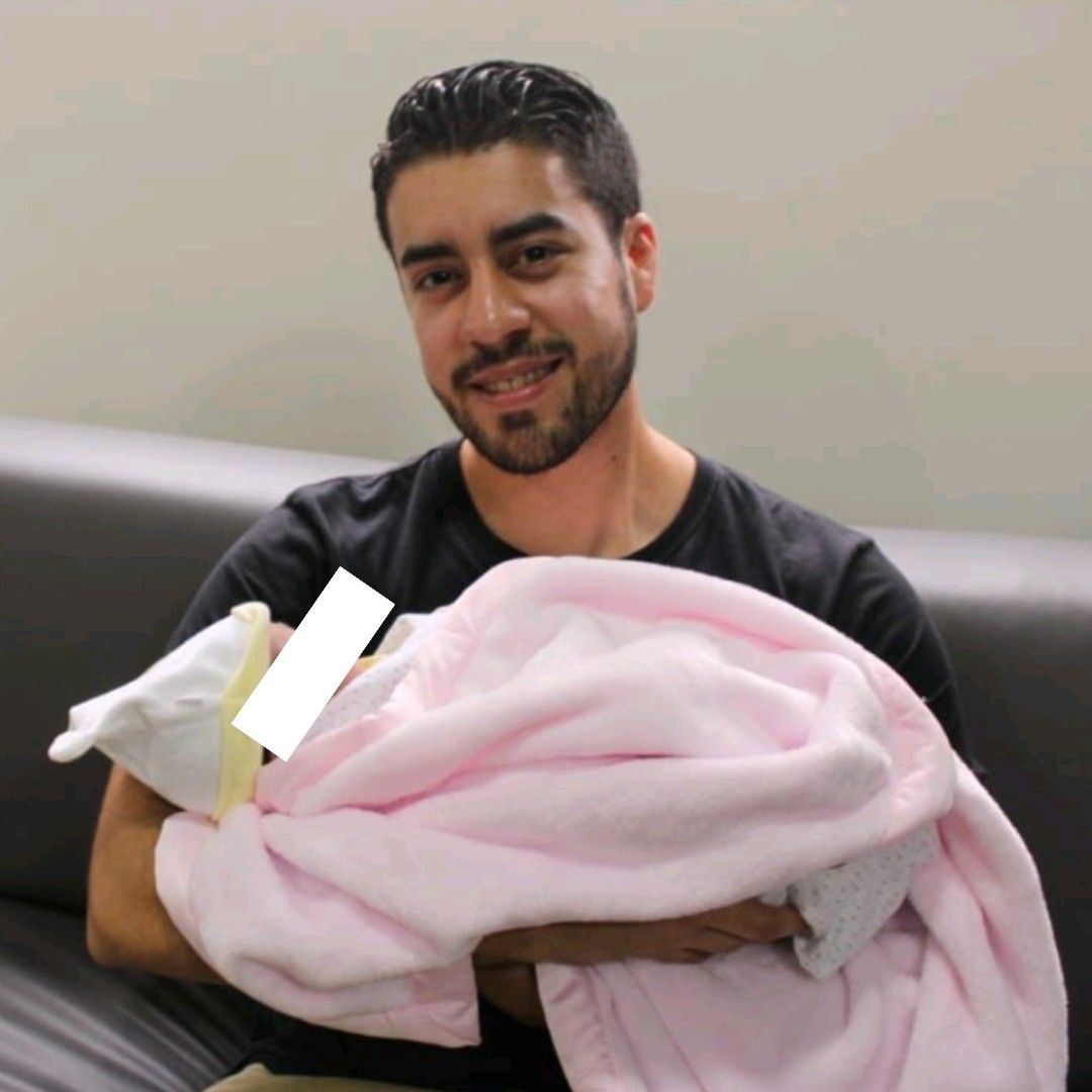 Emiliano holding his niece for the first time. 