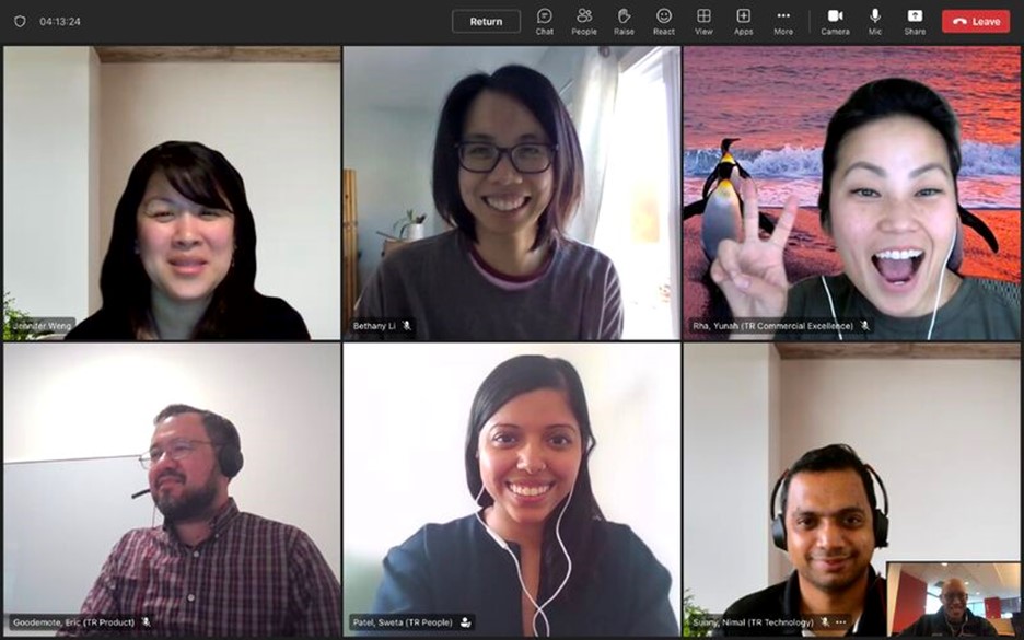 seven individuals on an Microsoft teams call all smiling looking into the camera 