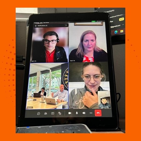 six individuals on an Microsoft teams call all smiling looking into the camera 